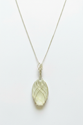 Silver Wire Wrapped Clear Quartz Pendant - Studio Background